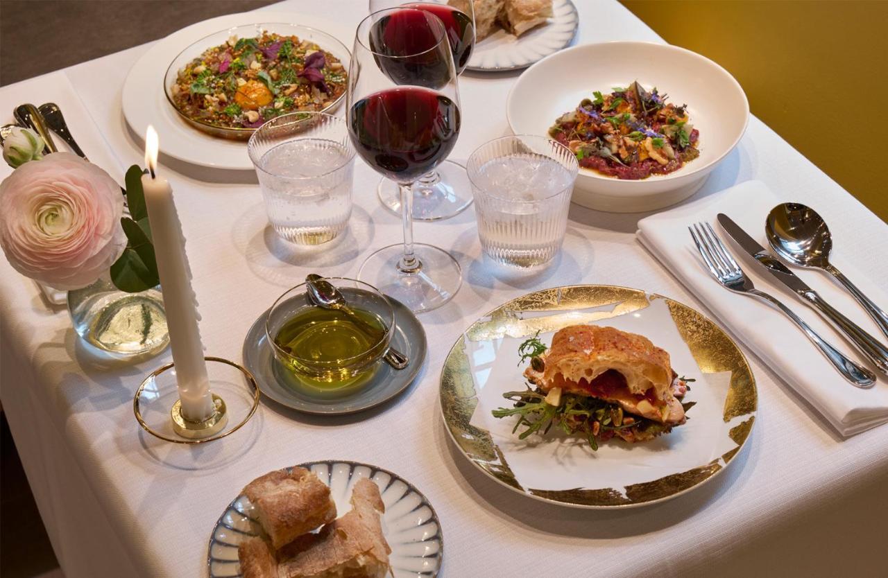 Villa Dagmar Стокхолм Екстериор снимка A selection of dishes at the restaurant